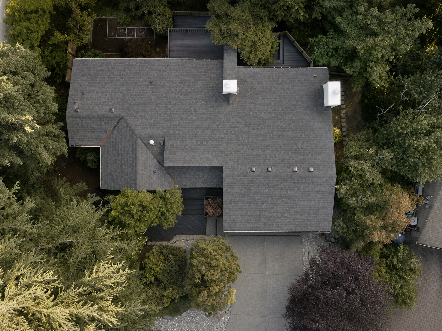 Overhead view of a multi-plane asphalt shingle roof replacement completed by GripGo Roofing
